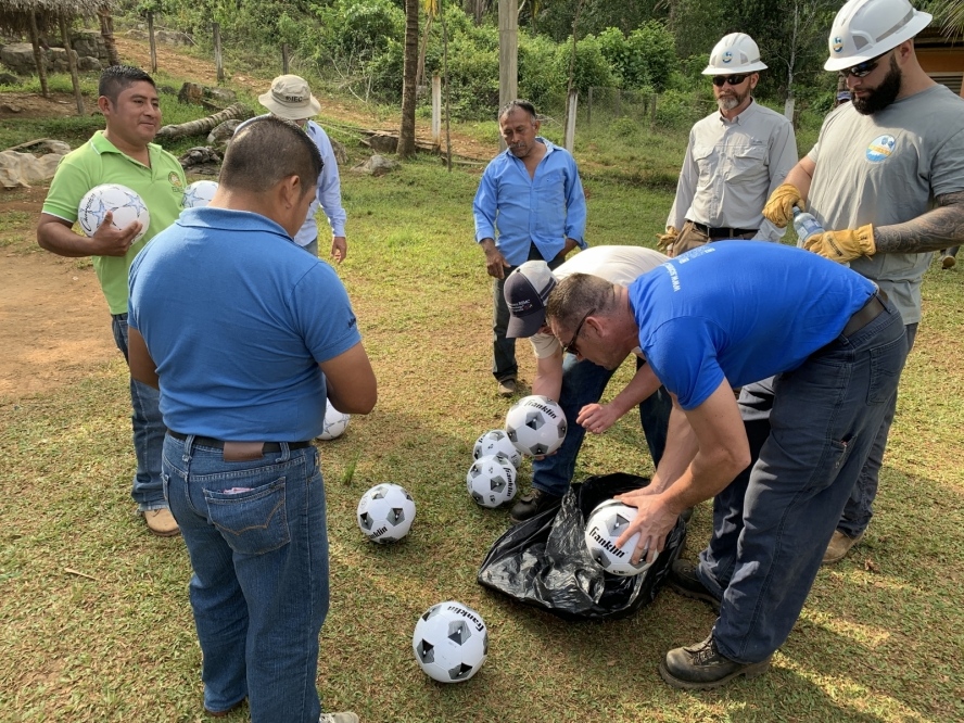 men with soccer balls