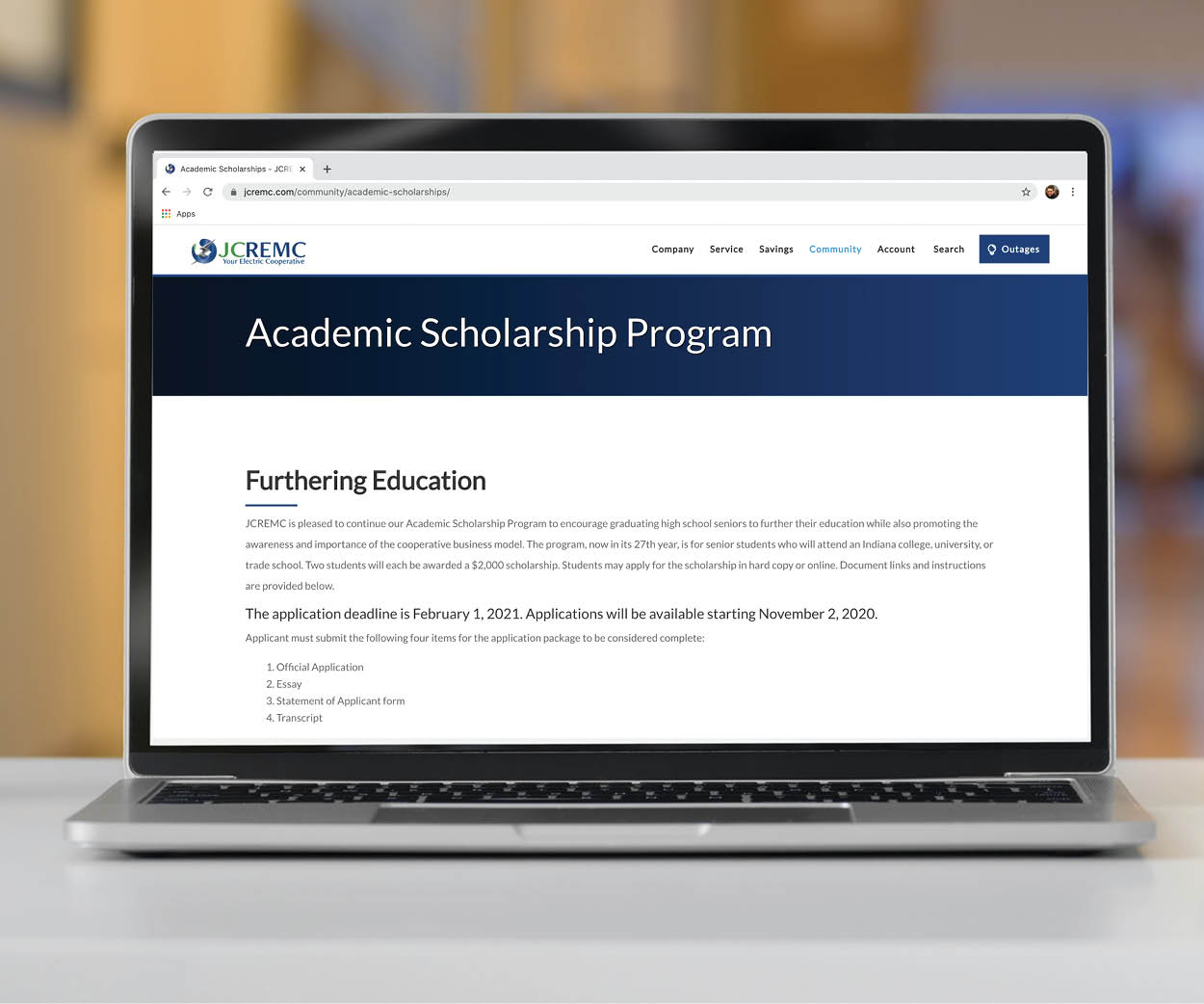 Laptop with JCREMC scholarships webpage