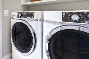 White front-load washing machine and dryer.