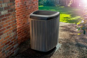 Energy efficient heat pump in a back yard.